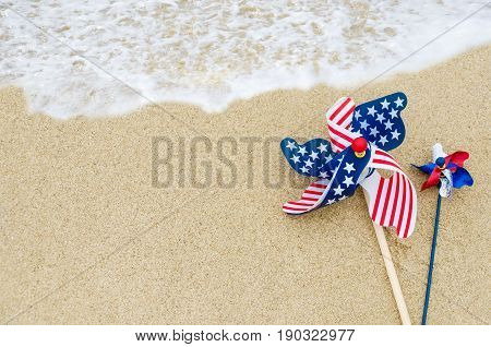 Patriotic USA background with decorations on the sandy beach