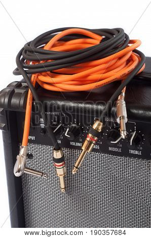 Close-up of guitar amplifier with jack cable.