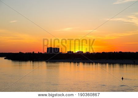 Orange Sunset Over A River Dnieper In Kremenchug City, Ukraine