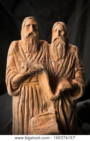 Slavonic Educators Cyril And Methodius Clay Statues Close Up Image. Old Men Hold Scroll Of Holy Scri