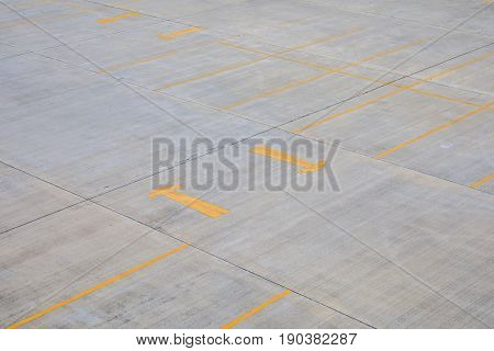 Empty parking slot at outdoor with yellow line and arrow.