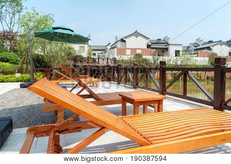 Leisure chairs and lake Huizhou ancient buildings