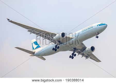 Bangkok, Thailand. - April 22, 2017 : Plane of Cathy Pacific Airlines or Airways on the sky landing to Suvanabhumi airport.
