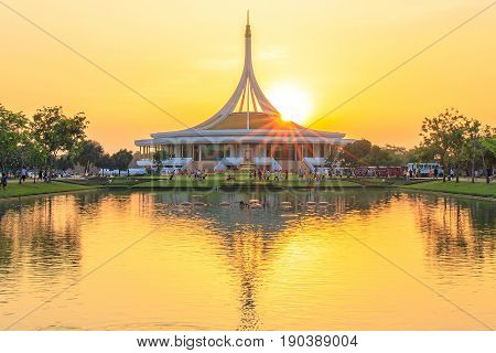 Bangkok, Thailand. - April 23, 2017 : Sunlight, Sunrays or sunbeam star over the roof of Ratchamangkhala Pavilion at public park name Suan Luang Rama IX on sunset time Bangkok, Thailand.