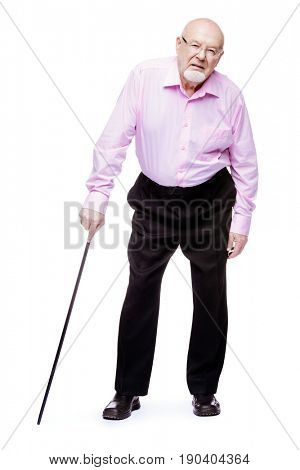 The old man standing with walking stick. Back hurts, radiculitis. Health care for the elderly people.