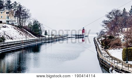 Town Of Charlevoix And South Pier Lighthouse On Lake Michigan
