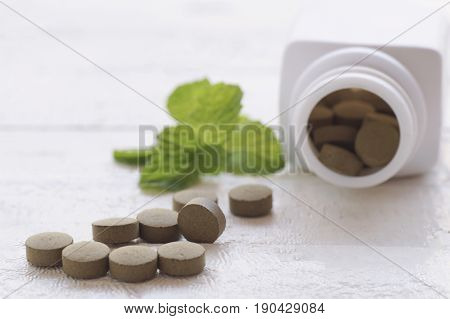 herb pill on top view of wood table and copy space