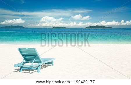 Beach tropical with relaxing chair white sandy and crystal water . Rawa island Malaysia .