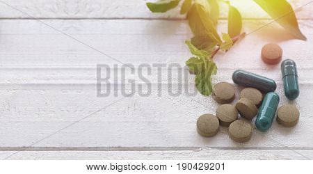 pill herbal on top view of wood table and copy space