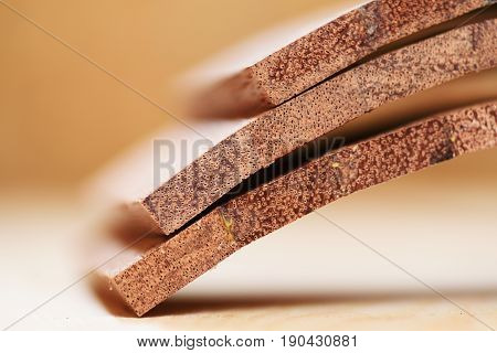 Merbau wood planks for handmade drum closeup selective focus
