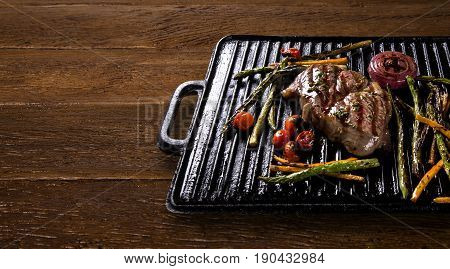 Ancho Steak With Grilled Vegetables On The Grill