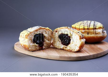 German Donuts - Berliner With Jam And Icing Sugar In A Tray On A Grey Background.