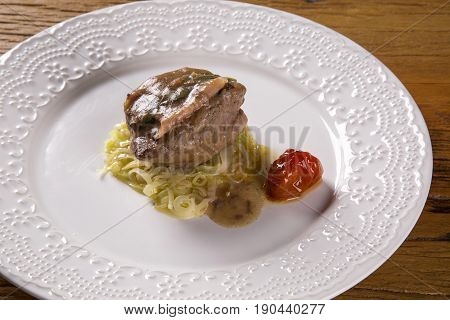 Saltimbocca Veals In Rich Neapolitan Sauce And Tagliatelle Pasta