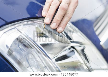 Refinish the headlights. Polished matt glass headlight with sand paper and water.