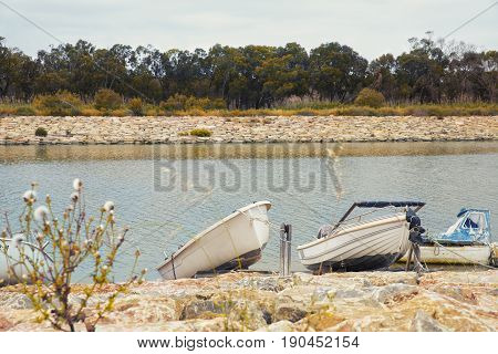 modest fishing boats in the river bank in Guardamar del Segura Alicante.Spain