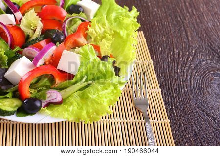 Fresh vegetables on wooden and blur background.