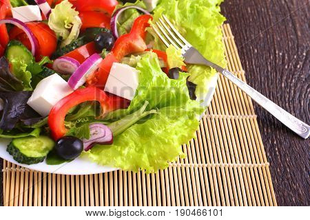 Fresh vegetables on wooden and blur background.