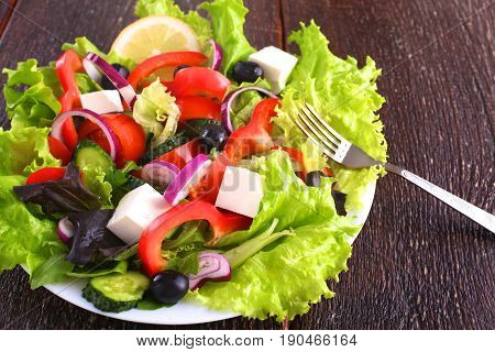Fresh vegetables on wooden and blur background.