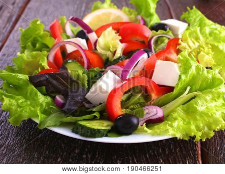 Fresh vegetables on wooden and blur background.