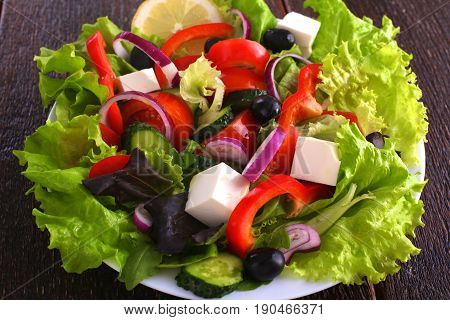 Fresh vegetables on wooden and blur background.