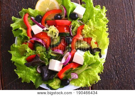 Fresh vegetables on wooden and blur background.