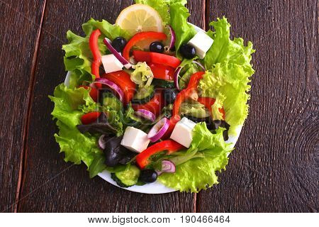 Fresh vegetables on wooden and blur background.