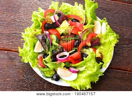 Fresh vegetables on wooden and blur background.