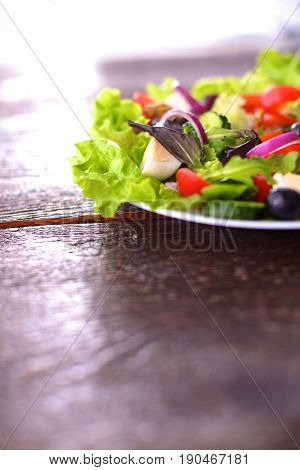 Fresh vegetables on wooden and blur background.