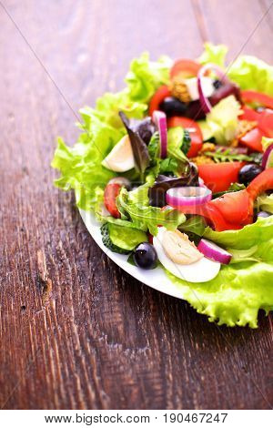 Fresh vegetables on wooden and blur background.