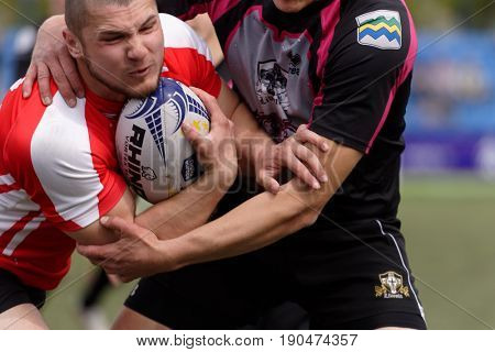 ST. PETERSBURG, RUSSIA - MAY 27, 2017: Match Busly, Belarus (red and white shirts) vs Livonia, Latvia during Rugby Europe Sevens Club Champion's Trophy.  