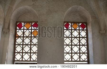 two vintage glass stained windows in the castle yellow and red colors