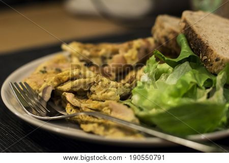 Scrambled Eggs With Salad And Whole Wheat Bread