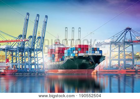 International Container Cargo ship with working crane bridge in shipyard background logistic import export background and transport industry.