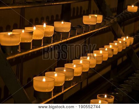 Rows of candles in a catholic church