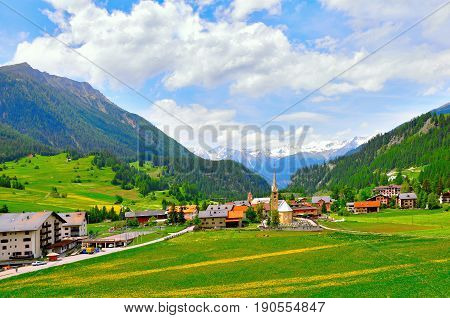 View of Bergun village and the alps from the train from Chur to St. Moritz. Canton of Grisons. Switzerland.