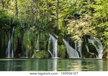 landscape with waterfall of plitvicka lake national park at sunset silky stream of water unesco heritage site plitivce croatia.