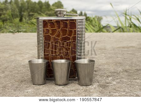 Metal cans and cups, fart it, on a concrete slab in the open air