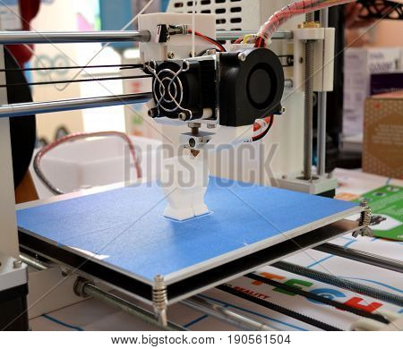 The process of working 3D printer and creating a three-dimensional object. Progressive modern additive technology. 4ht industrial revolution.