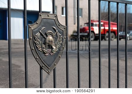 Murmansk, Russia - May 25, 2010: Emblem of the State Fire Service at the gate of the fire station Murmansk