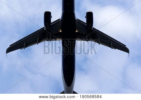 The underside of a modern airplane and its landing gear