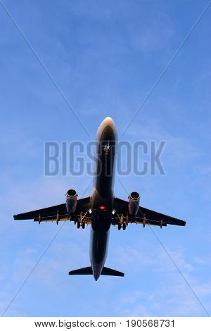 The underside of a modern airplane and its landing gear