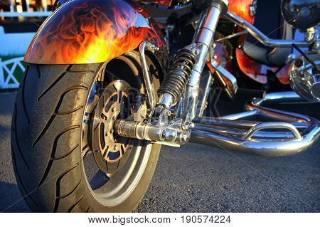Tricycle custom motorcycle stands on the city