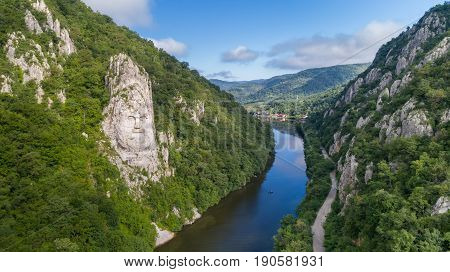 Decebal Head sculpted in rock Danube Gorges (Cazanele Dunarii) Romania. Aerial view.