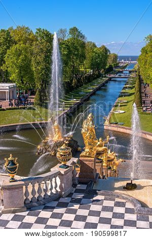 Petergof, Russia - June 5, 2017: The Grand Cascade and Samson Fountain at the Grand Peterhof Palace. These palaces and gardens are sometimes referred as the -Russian Versailles-. Background: The Sea Canal.