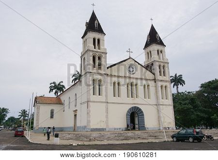 SAO TOME, SAO TOME AND PRINCIPE - FEBRUARY 1, 2017: People in front of the cathedral of Sao Tome city in the evening hours on February 1, 2017 in Sao Tome and Principe, Africa