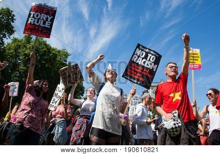 London, UK - June 10 2017: Unidentified protesters  at Westminster Palace expressing their anger at Theresa May's government and her alliance with the Democratic Unionist Party, London, UK