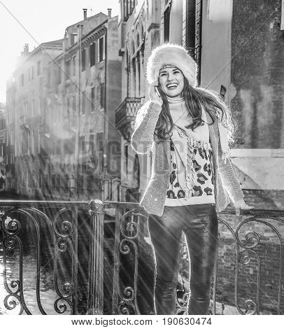 Smiling Woman In Venice, Italy In Winter Speaking On Cell Phone