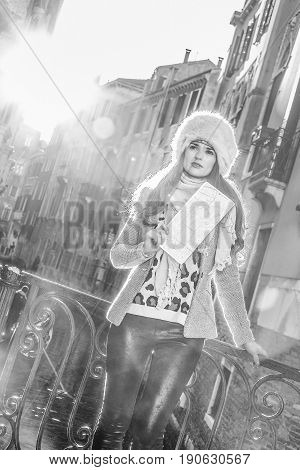 Trendy Tourist Woman In Venice, Italy In Winter With Map
