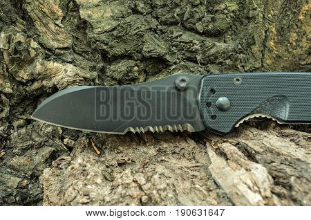 Kind Of A Tactical Knife Blade. Tactical Knife With A Serritorial Blade.