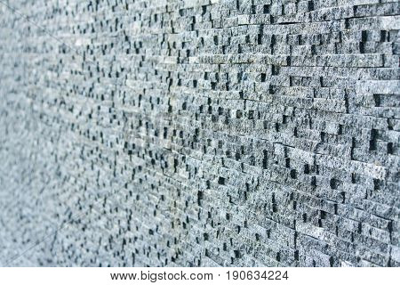 Dark grey stone tile dbrick wall backgrounf